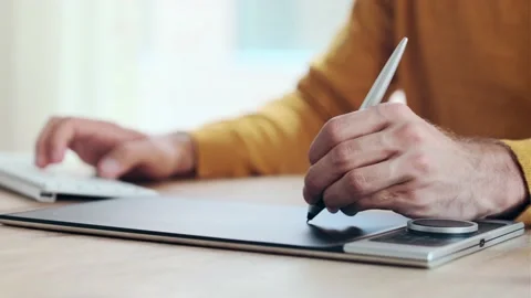 Video of close up of hands of graphic designer using a pen tablet while worki Stock Footage 167079791