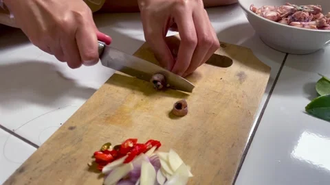 Video close-up hands slicing squid . Stock Footage 322588809