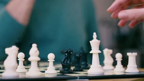 Video of close up of mature man playing chess with a friend at home Stock Footage 340829034