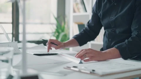 Video of close-up of smart architect hands working and drawing with pen over  Stock Footage 171980345