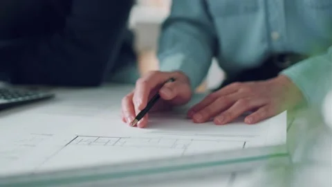Video of close-up of smart architects holding pen over diagram on paper in th Video stock 171980436