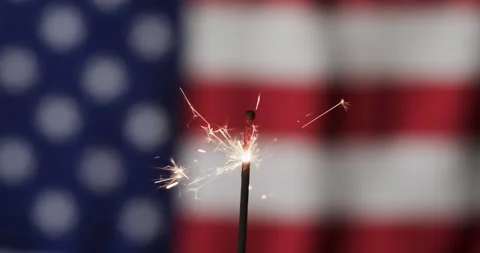 Video of close up of sparkler with copy space over flag of usa Video stock 331307439