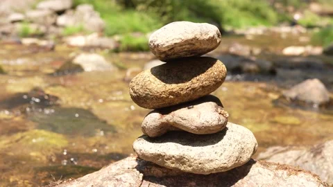 The Video of Close-up of stack of stones in perfect balance accomplish work i Stock Footage 136511676
