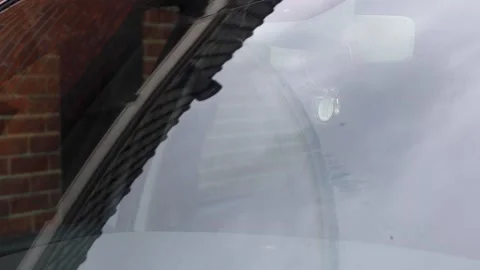 Video close up of windshield wipers cleaning windshield of a car. Stock Footage 341681798