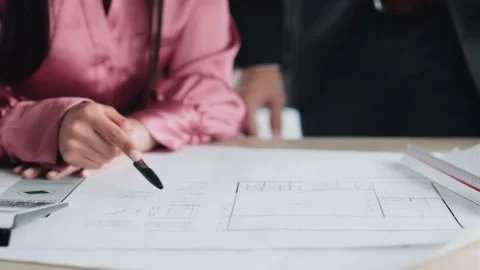 Video of closeup of smart architects working with plans while talking of th.. 스톡 동영상 227886671