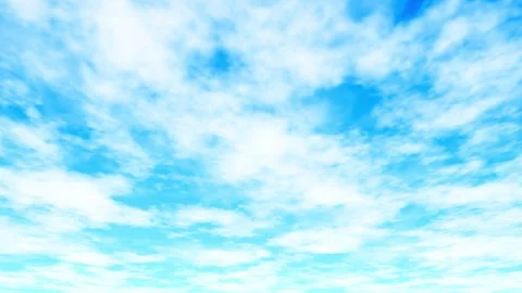 A video of clouds drifting across a blue sky. Loop Stock Footage 335277349