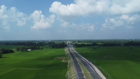 Video of clouds over the highway running across green farms Video stock 252009277