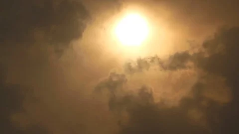 Video of clouds passing in front of the sun camera facing at sun Stock Footage 94320749