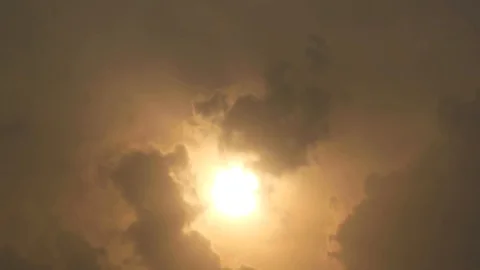 Video of clouds passing in front of the sun camera facing at sun Stock Footage 94321196
