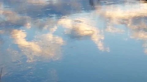 Video of clouds at sunset reflected in the waters of a river Video stock 145290682