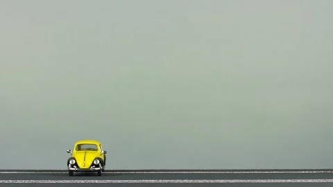 Video of a collision between two yellow car figurines. Stock Footage 133489842
