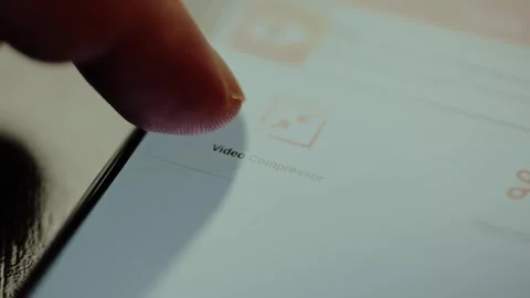 Video Compressor function with scissors icon within an application for editing Stock Footage 326945159