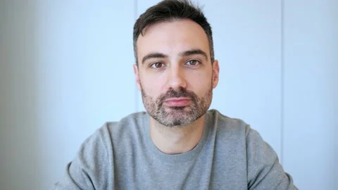 Video of confident mature man explicate something looking at camera while doi Stock Footage 153286794