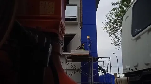 Video of construction workers inserting gypsum board from outside the window Stock Footage 304610390