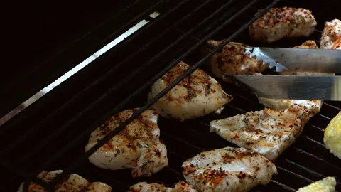 Video of cooking chicken on the grill in real slow motion Stock Footage
