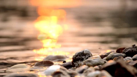Video corner near the rocky edge of the river, blurred in the water, a shadow of Stock Footage 126233003