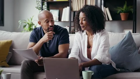 Video of couple using their laptop to consulting some invoices and document.. Stock Footage 328186588