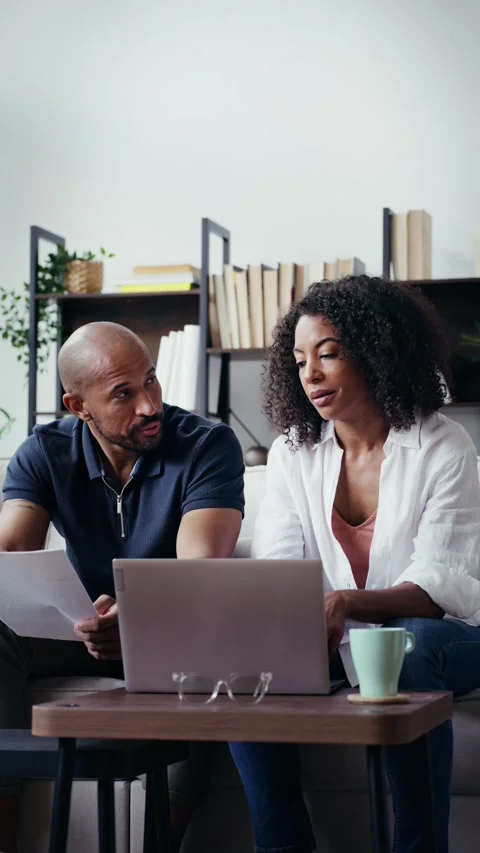 Video of couple using their laptop to consulting some invoices and document.. Stock Footage 328186735