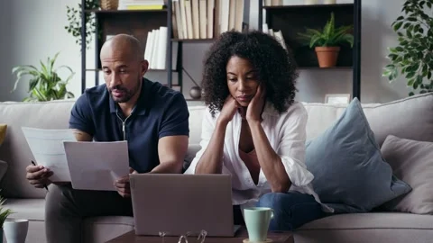 Video of couple using their laptop to consulting some invoices and document.. Video stock 328186747