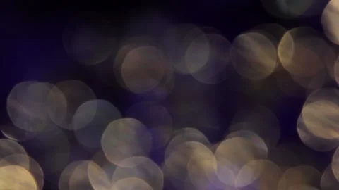 Video coverage of blue and gold bokeh light leaks side by side Stock Footage 317533296