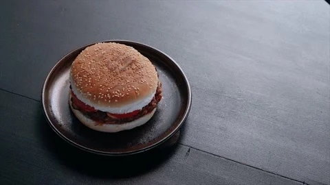 Video crop with an appetizing burger prepared according to a special recipe in Stock Footage 137895706