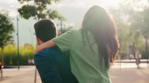 Video of cute couple having fun together in a park 動画素材 332846971
