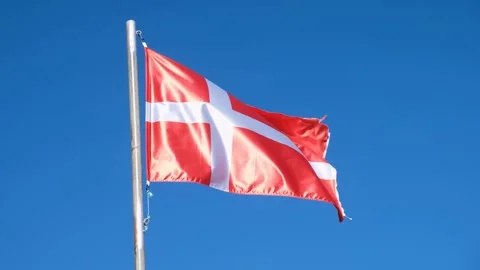 A video of the danish flag the Dannebrog on a flagpole on a sunny day natio.. Stock Footage 314651706