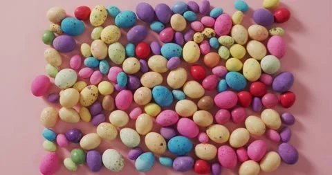 Video of decorated colorful easter eggs on a pink surface Stock Footage 340880952