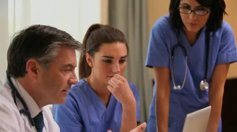 Video of doctor with nurses in hospital Stock Footage