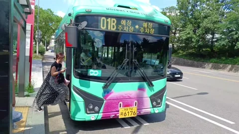 Video of downtown circulation bus operation in front of Jangchung Gymnasium in S Stock Footage 313481993