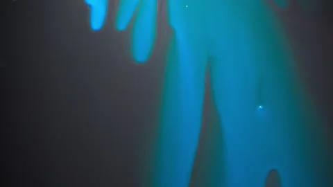 Video of draining blue paint's drops on glass background Video stock 140918168