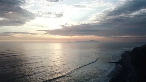 Video of a dramatic sunset over the ocean with storm clouds in the sky. Stock Footage 236274195