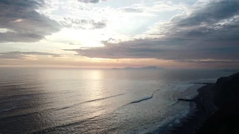 Video of a dramatic sunset over the ocean with storm clouds in the sky. Stock Footage 236274196
