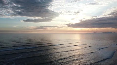 Video of a dramatic sunset over the ocean with storm clouds in the sky. Stock Footage 236274247