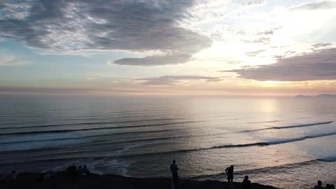 Video of a dramatic sunset over the ocean with storm clouds in the sky. Stock Footage 236274277