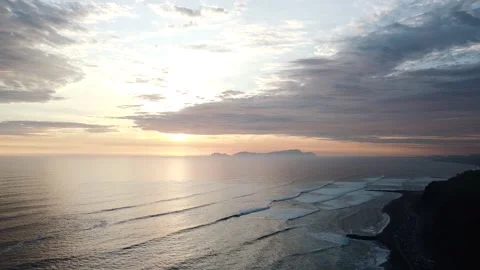 Video of a dramatic sunset over the ocean with storm clouds in the sky. Stock Footage 236274282
