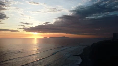 Video of a dramatic sunset over the ocean with storm clouds in the sky. Stock Footage 236274289