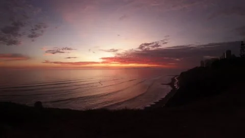 Video of a dramatic sunset over the ocean with storm clouds in the sky. Stock Footage 236274290