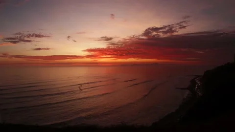 Video of a dramatic sunset over the ocean with storm clouds in the sky. Stock Footage 236274376