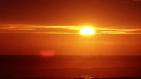 Video of a dramatic sunset over the ocean with storm clouds in the sky. Stock Footage 236274786