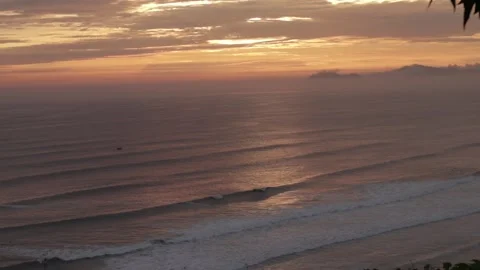 Video of a dramatic sunset over the ocean with storm clouds in the sky. Stock Footage 236274817