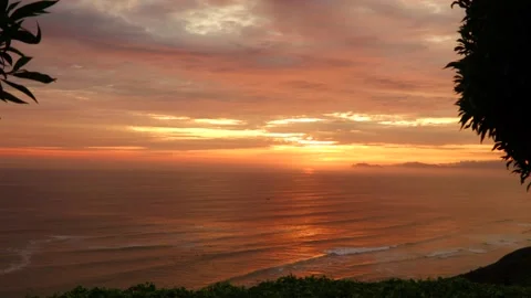 Video of a dramatic sunset over the ocean with storm clouds in the sky. Stock Footage 236274854