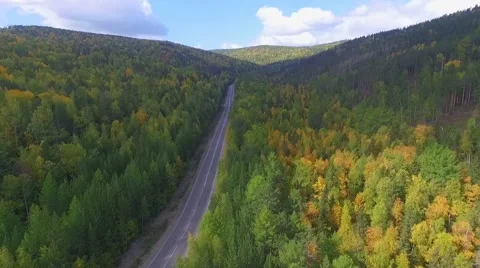 Video drone aerial view over the road in the forest on the way to Lake Baikal Stock Footage