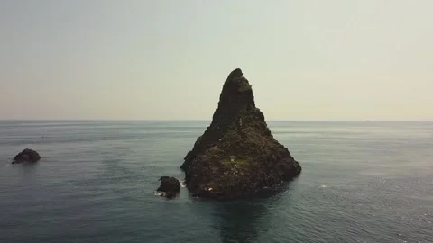 Video with drone approaching the stacks of Acitrezza on the Ionian coast Stock Footage 146802919