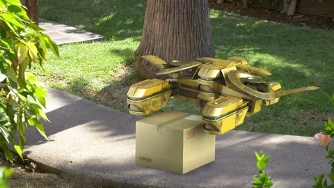 Video of drone delivers a parcel in front of the house in 4k Stock Footage 78578572