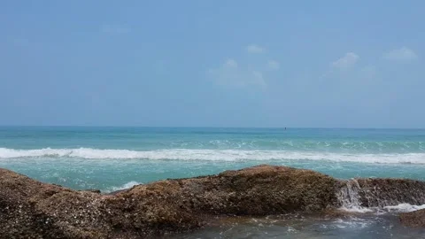 Video from a drone flying towards the waves into the ocean. Clear water at koh Stock Footage 143257860