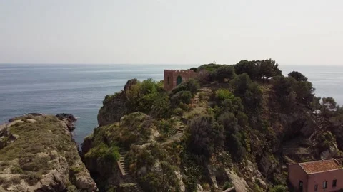 Video with drone moving away from Lachea island in the Ionian coast in Sicil Stock Footage 146803066