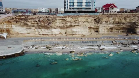 Video from a drone in the valley of the rocks on the background of the city. Stock Footage 238894679