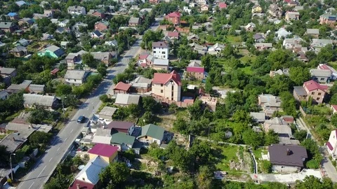 Video from the drone. View from high to a car that rides along an asphalt road Stock Footage 83155363