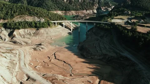 Video of drone views of a mountain landscape with a river crossing a bridge Video stock 233820739